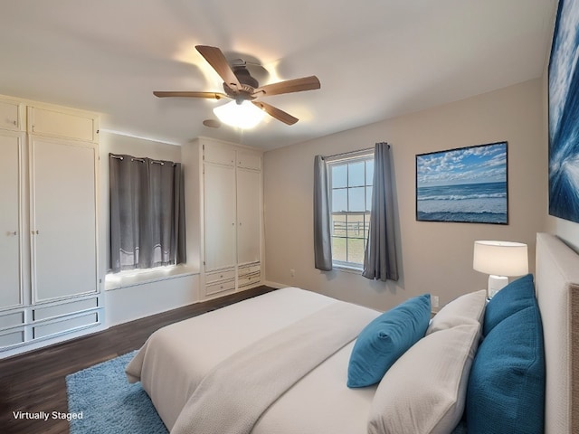 bedroom featuring dark wood-type flooring and ceiling fan