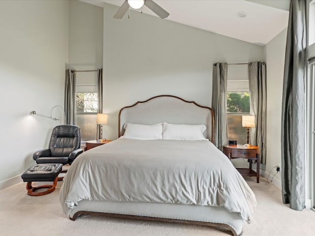 bedroom featuring light colored carpet, high vaulted ceiling, and ceiling fan