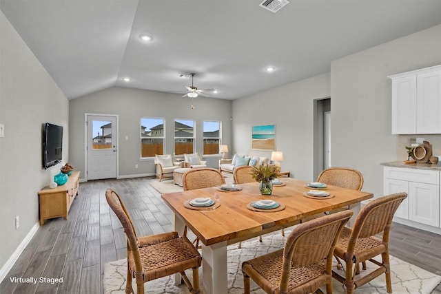 dining area featuring vaulted ceiling and ceiling fan