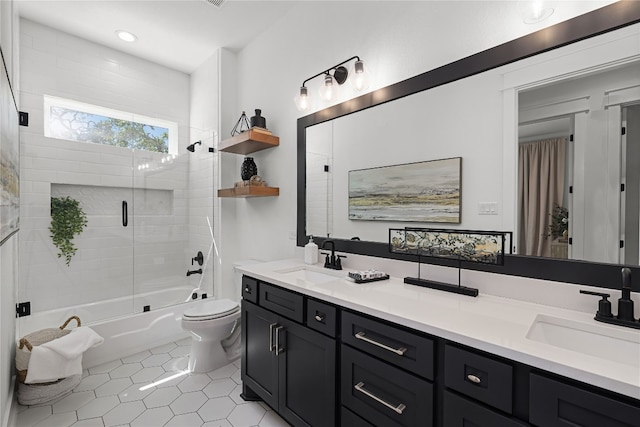 full bathroom with vanity, toilet, enclosed tub / shower combo, and tile patterned flooring