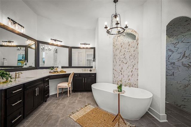 bathroom featuring vanity, tile patterned flooring, and a washtub