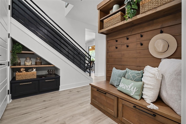 mudroom with light hardwood / wood-style flooring