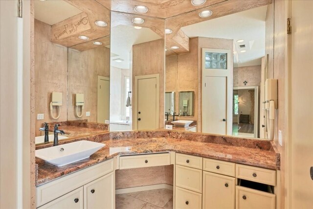 100 Silver Spur, Horseshoe Bay, TX 78657 - full bathroom featuring tile patterned flooring, recessed lighting, and vanity
