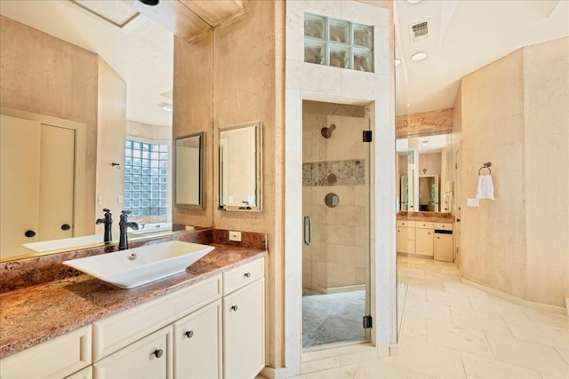 bathroom with vanity and an enclosed shower