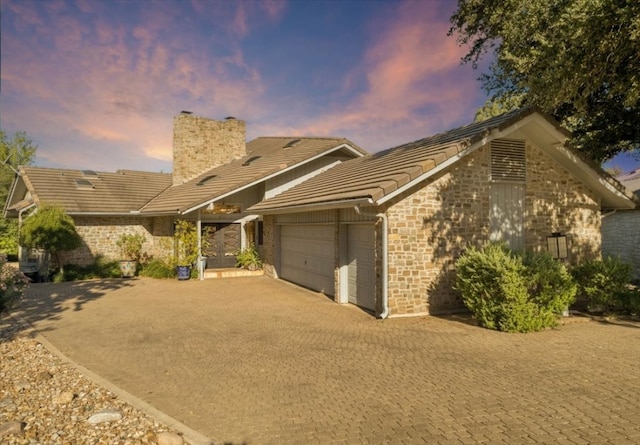 single story home with a garage