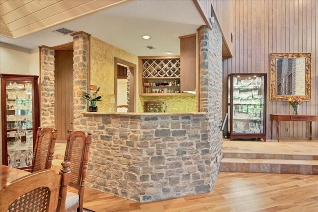 100 Silver Spur, Horseshoe Bay, TX 78657 - indoor bar featuring wood finished floors, wood walls, and recessed lighting