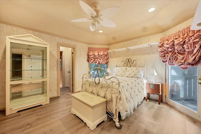 bedroom featuring ceiling fan, wood-type flooring, and ornamental molding