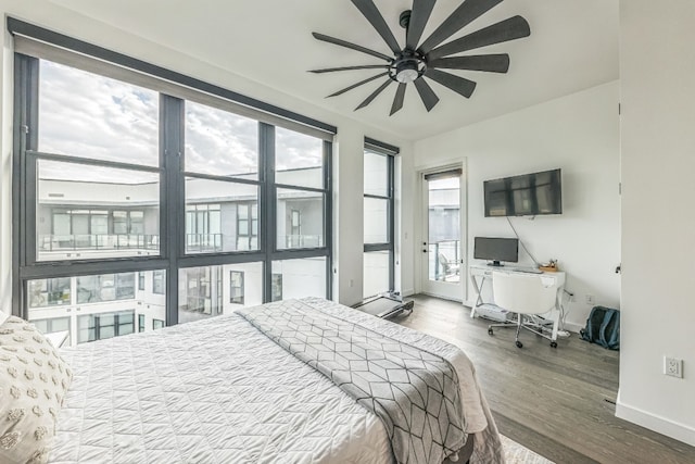 bedroom featuring hardwood / wood-style floors and ceiling fan