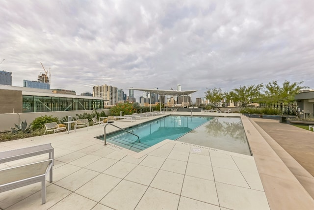 view of swimming pool featuring a patio area