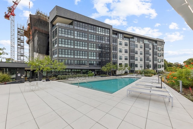 view of swimming pool with a patio area