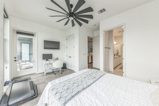 bedroom featuring connected bathroom, access to outside, wood-type flooring, and ceiling fan