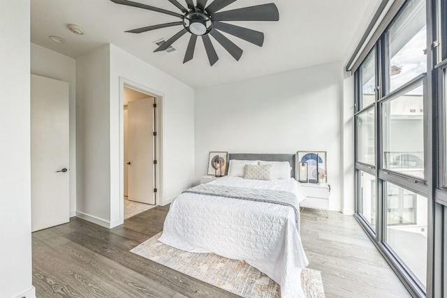 bedroom featuring wood-type flooring and ceiling fan