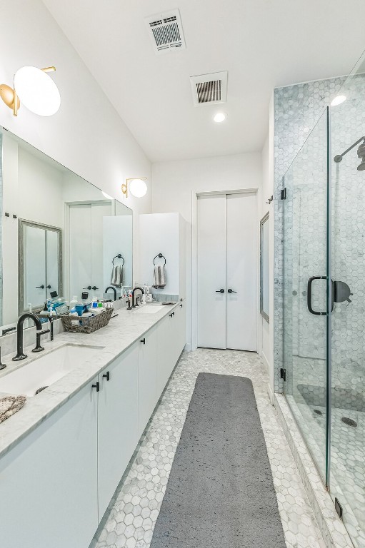 bathroom featuring vanity and walk in shower