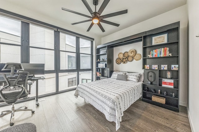 bedroom with wood-type flooring and ceiling fan