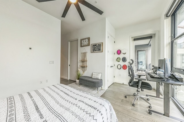 bedroom featuring ceiling fan and light wood-type flooring