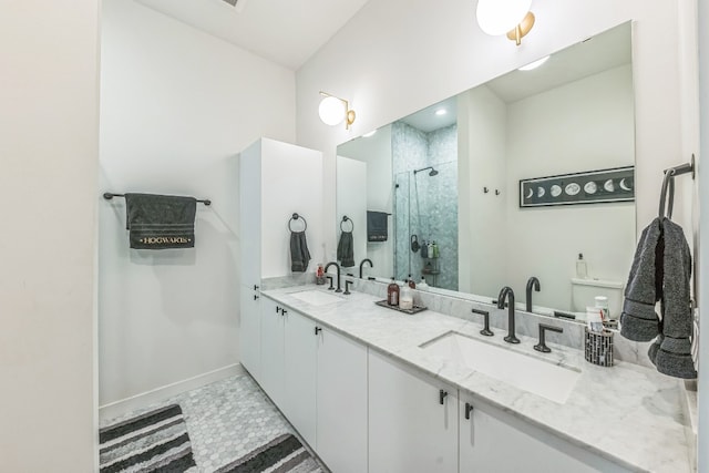 bathroom with vanity, an enclosed shower, and tile patterned floors