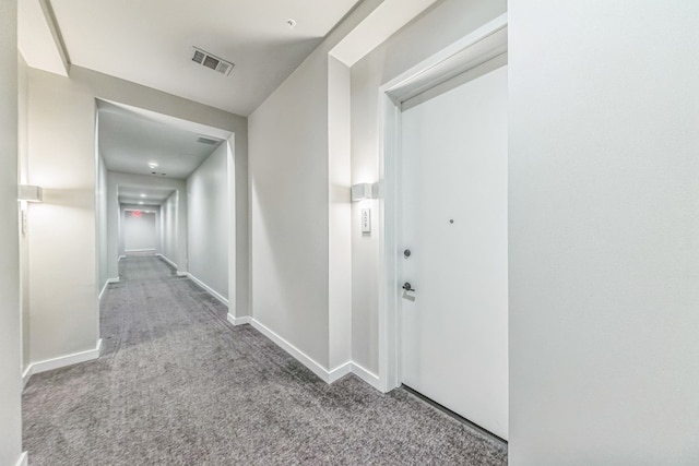 hallway featuring carpet flooring