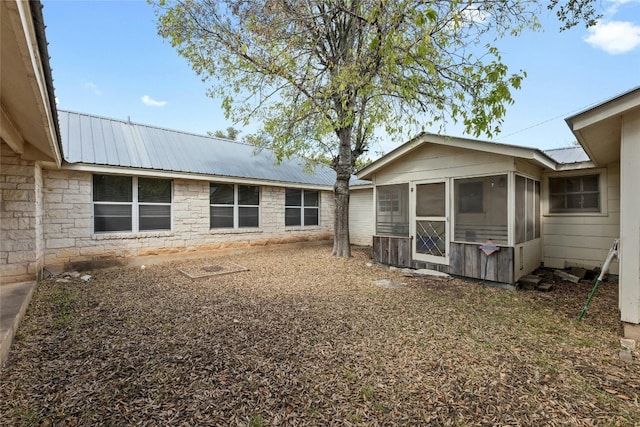 rear view of house with a sunroom