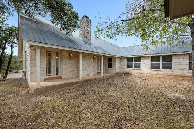 back of property featuring a patio area and french doors