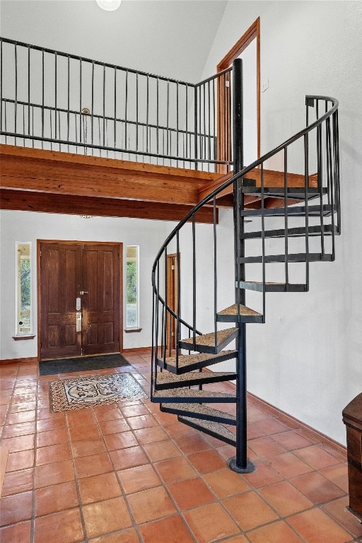 entryway with high vaulted ceiling and plenty of natural light