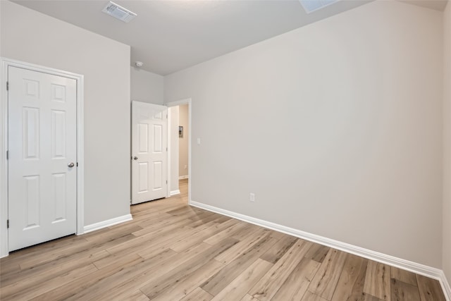 unfurnished bedroom with light hardwood / wood-style floors