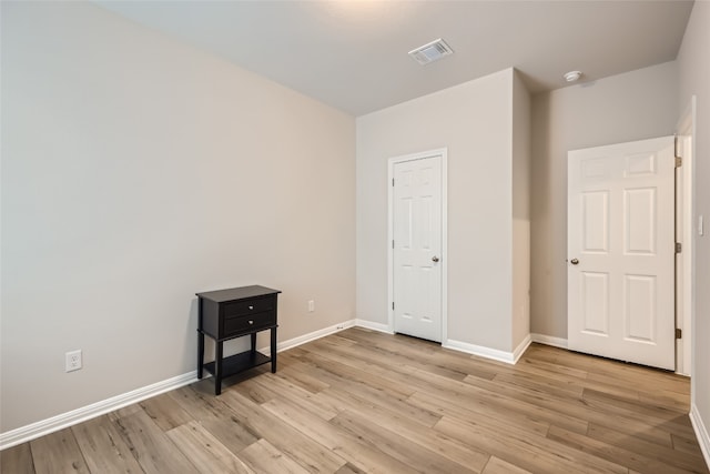 unfurnished room featuring light wood-type flooring