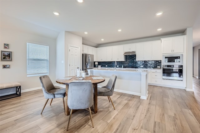 dining room featuring light hardwood / wood-style floors