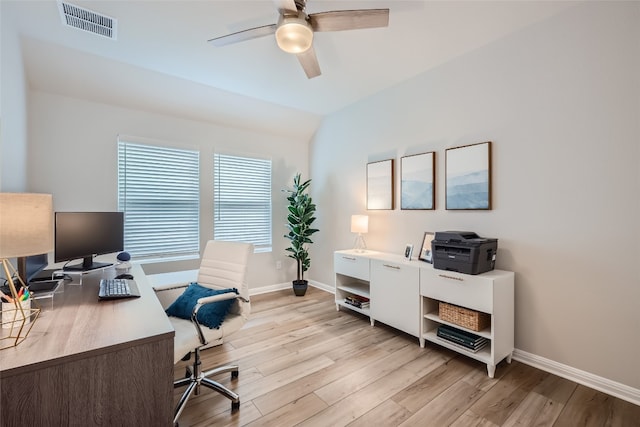 office space featuring ceiling fan, light hardwood / wood-style flooring, and lofted ceiling