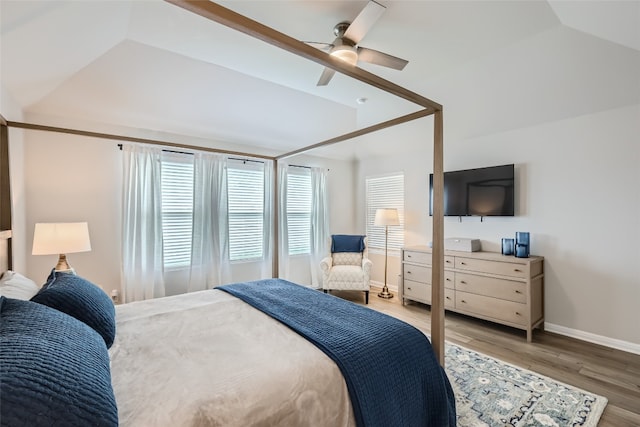 bedroom featuring hardwood / wood-style floors, ceiling fan, and lofted ceiling