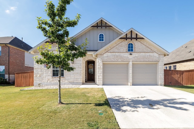 view of front of home featuring a front lawn and a garage