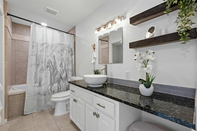 full bathroom with tile patterned flooring, vanity, toilet, and shower / tub combo with curtain