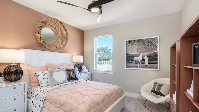 bedroom featuring light carpet and ceiling fan