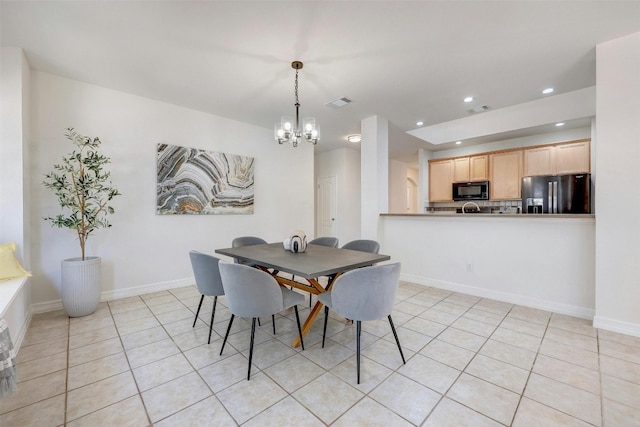 tiled dining area with an inviting chandelier