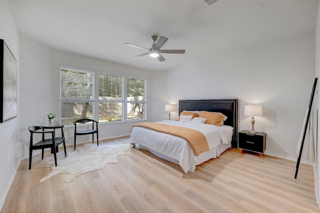 bedroom featuring light wood-type flooring and ceiling fan