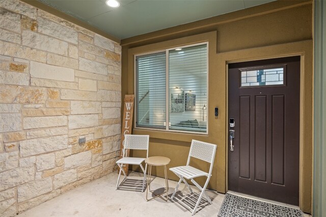 property entrance with a patio area