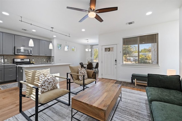 4408 Banister Ln Unit B, Austin, TX 78745 - living area featuring light wood-type flooring, a ceiling fan, visible vents, and recessed lighting