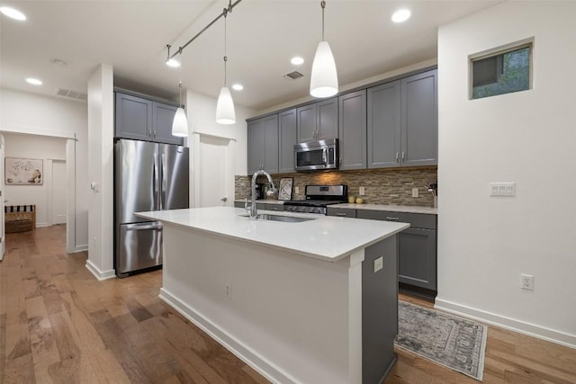 4408 Banister Ln Unit B, Austin, TX 78745 - kitchen with backsplash, appliances with stainless steel finishes, a sink, and visible vents