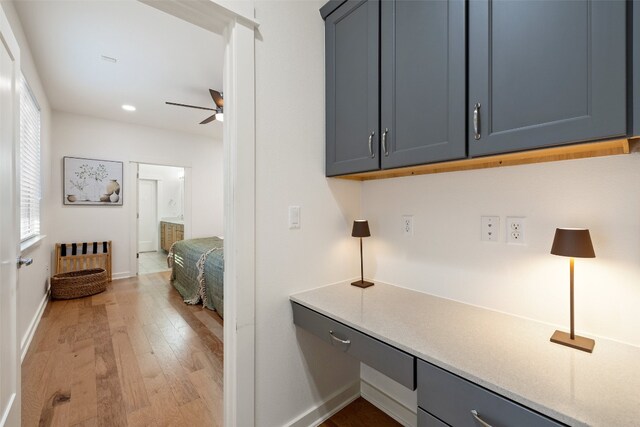 interior space featuring light wood-type flooring and ceiling fan