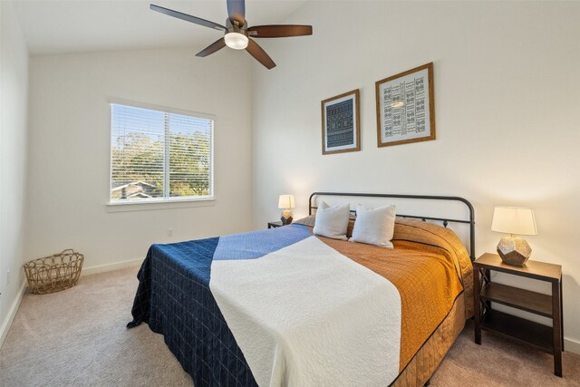 carpeted bedroom featuring ceiling fan and vaulted ceiling