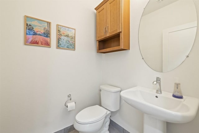 4408 Banister Ln Unit B, Austin, TX 78745 - half bath featuring toilet, baseboards, and a sink