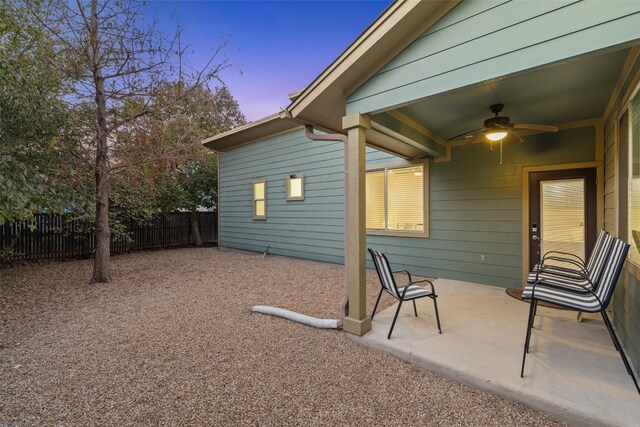 exterior space with ceiling fan