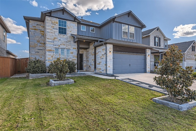 view of front of property featuring a front lawn and a garage