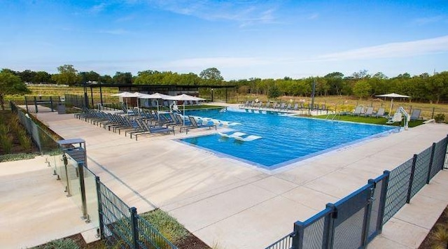 community pool with a patio area