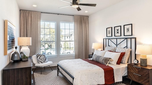 bedroom featuring baseboards, a ceiling fan, recessed lighting, and wood finished floors