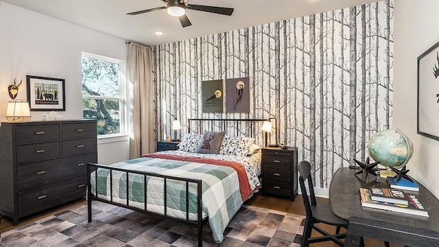 bedroom with recessed lighting, ceiling fan, an accent wall, and dark wood-style floors