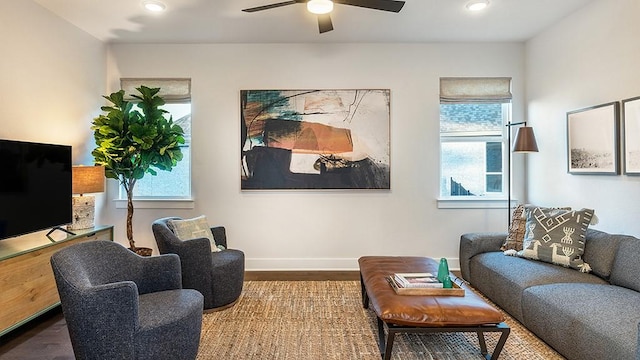living room with baseboards, a ceiling fan, wood finished floors, and recessed lighting