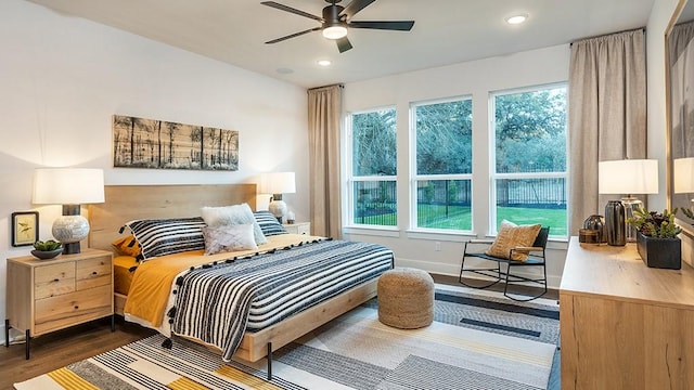 bedroom featuring recessed lighting, baseboards, ceiling fan, and dark wood-style flooring