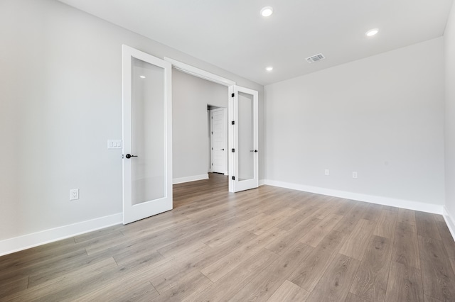 9213 Flatbush Dr, Austin, TX 78744 - empty room with baseboards, recessed lighting, and light wood-style flooring