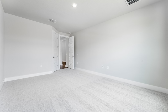 9213 Flatbush Dr, Austin, TX 78744 - carpeted spare room with baseboards and recessed lighting