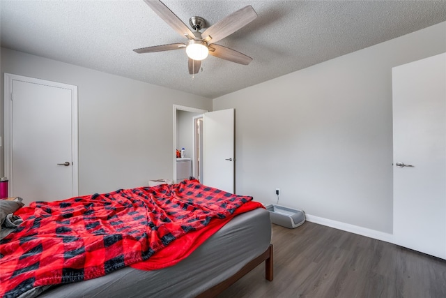 bedroom featuring ceiling fan, a textured ceiling, and dark hardwood / wood-style flooring